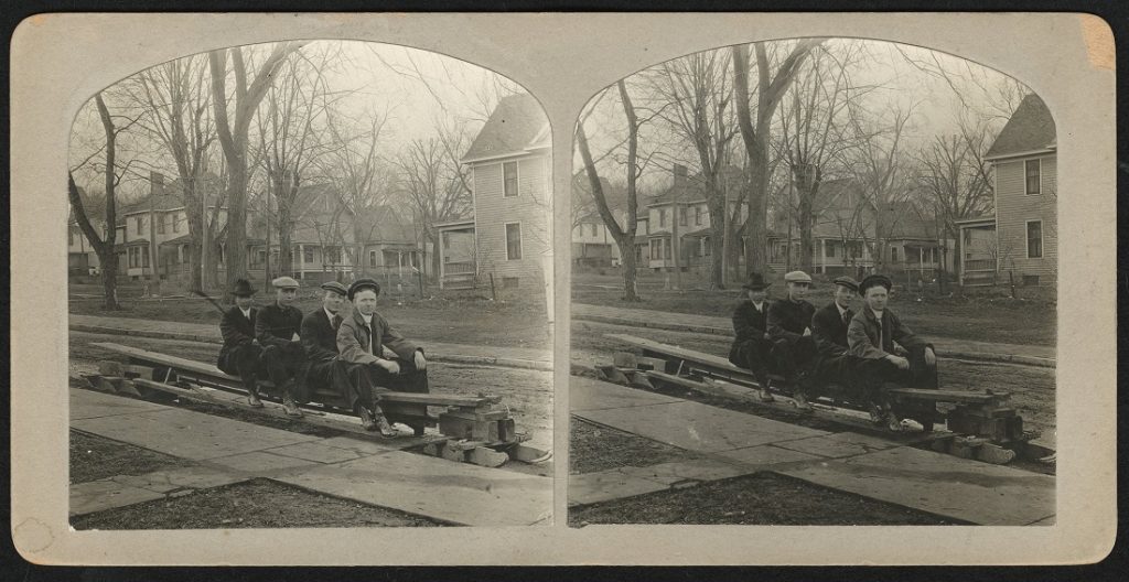 Photograph of KU students on a makeshift bobsled, 1912