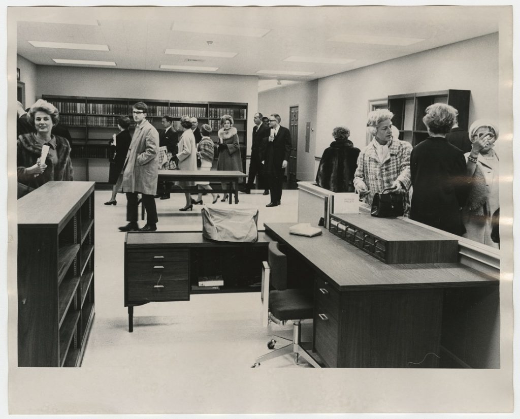 Photograph of guests touring the Special Collections reception area after the dedication of Kenneth Spencer Research Library, November 8, 1968