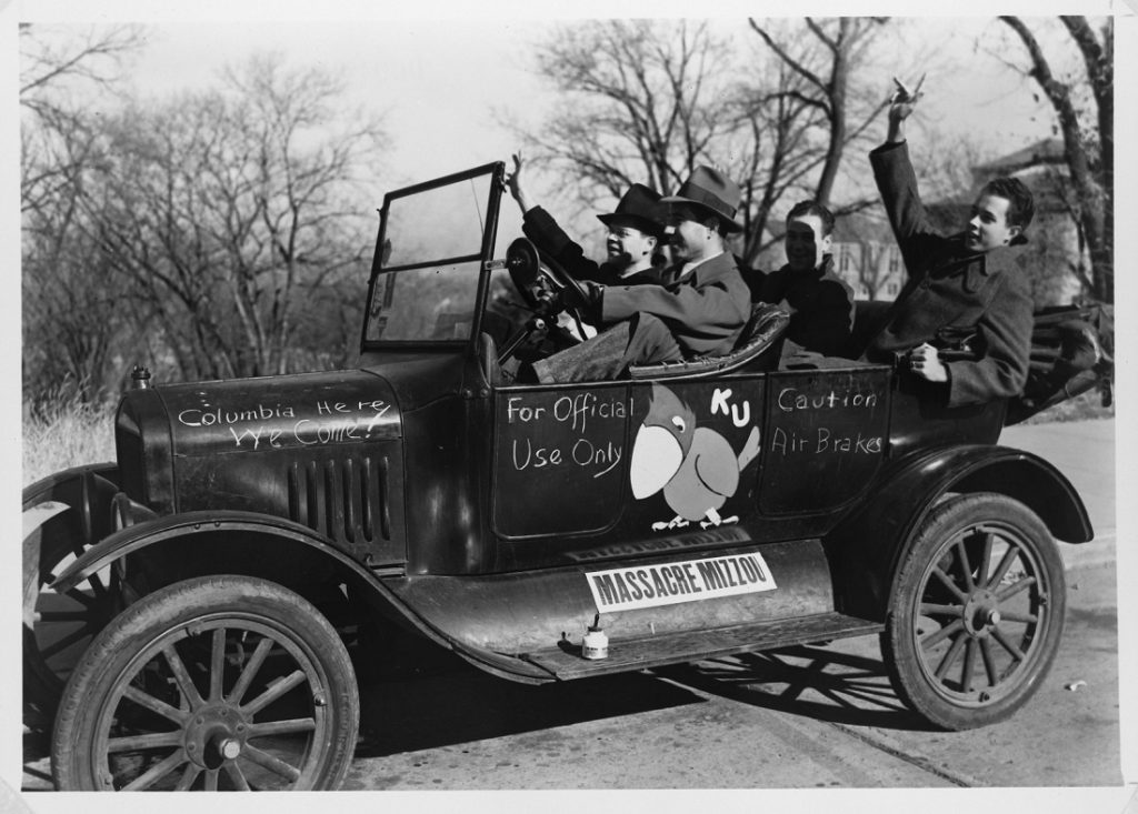 Photograph of KU football fans in a decorated car, 1940