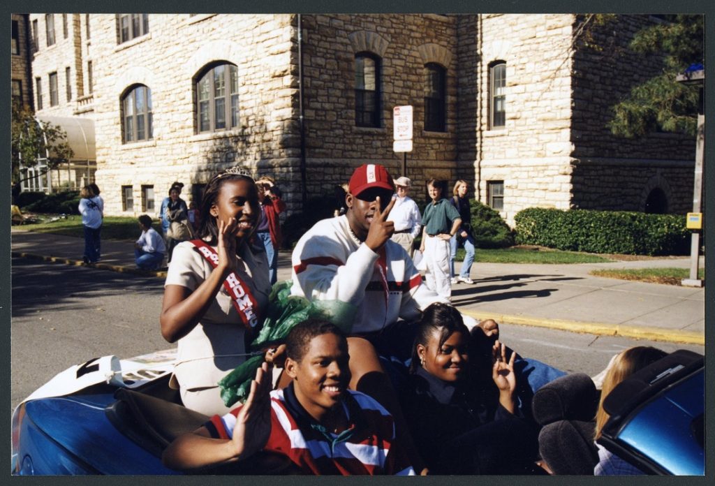Photograph of Black Student Union students riding in the Homecoming parade, 1998 