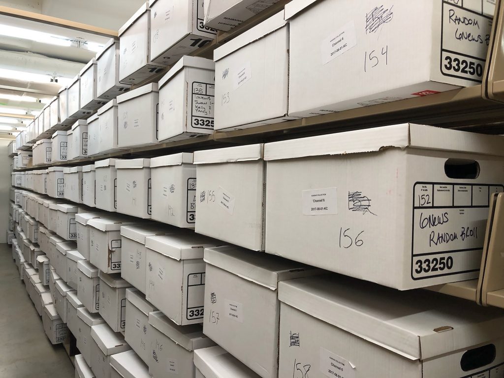 Boxes containing video tapes and other material from the Channel 6 collection acquired by Spencer Research Library in 2018.