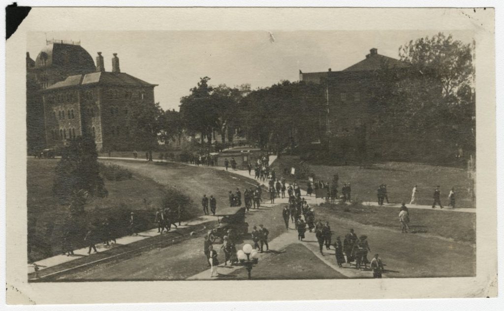 Photograph of students walking on campus, 1919