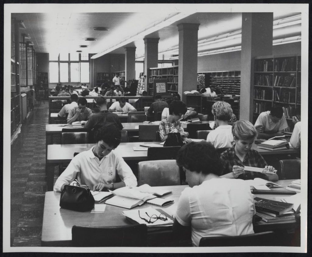 Photograph of KU students working in the Undergraduate Reading Room at Watson Library, 1962