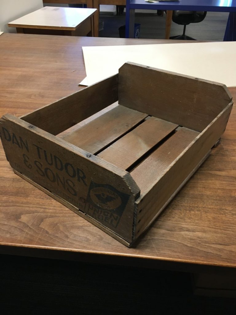 Photograph of a wooden pickers’ crate displaying the United Farm Workers' stamp