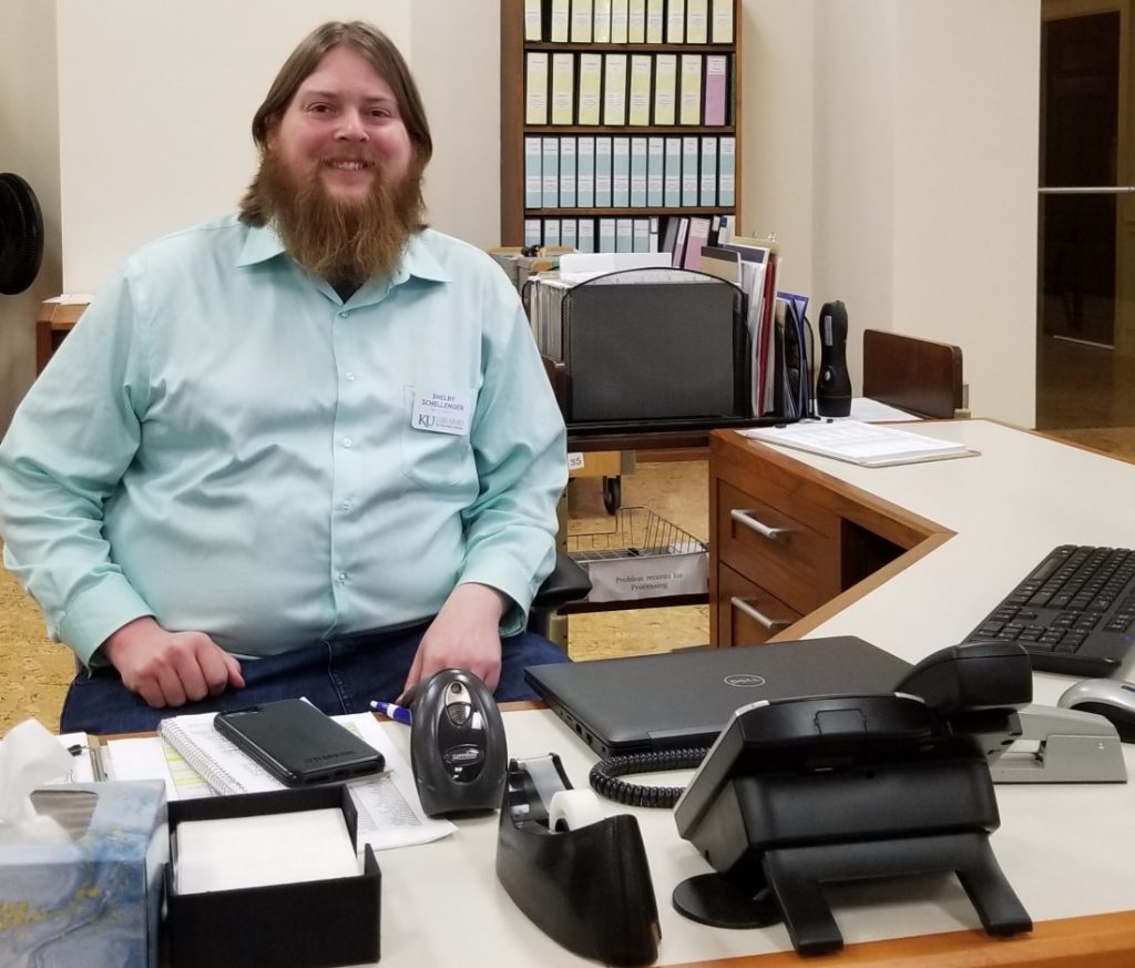 Photograph of Shelby Schellenger at Spencer's reference desk