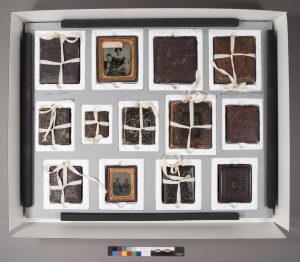 Lower tray of housing for cased photographs from the Frowe and Lathrop Families Records.