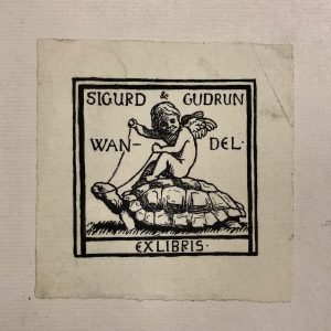 Image of the bookplate of Bookplate of Sigurd & Gudrun Wandel in MS C68, which features a cherub riding a tortoise.