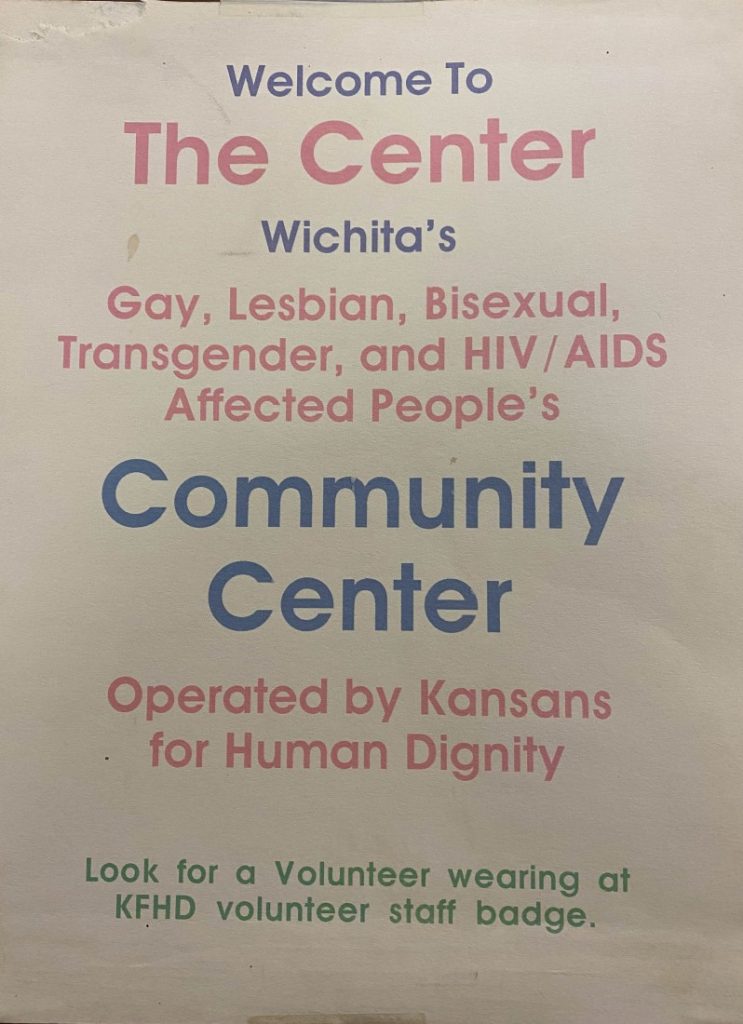 Text that reads "Welcome to The Center, Wichita's Gay, Lesbian, Bisexual, Transgender, and HIV/AIDS Affected People's Community Center, Operated by Kansans for Human Dignity. Look for a Volunteer wearing a KFHD volunteer staff badge."