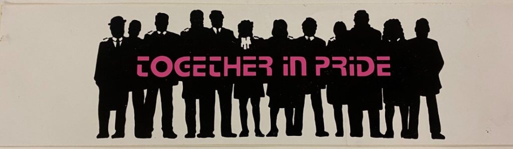Pink text with a row of people in black silhouette against a white background.