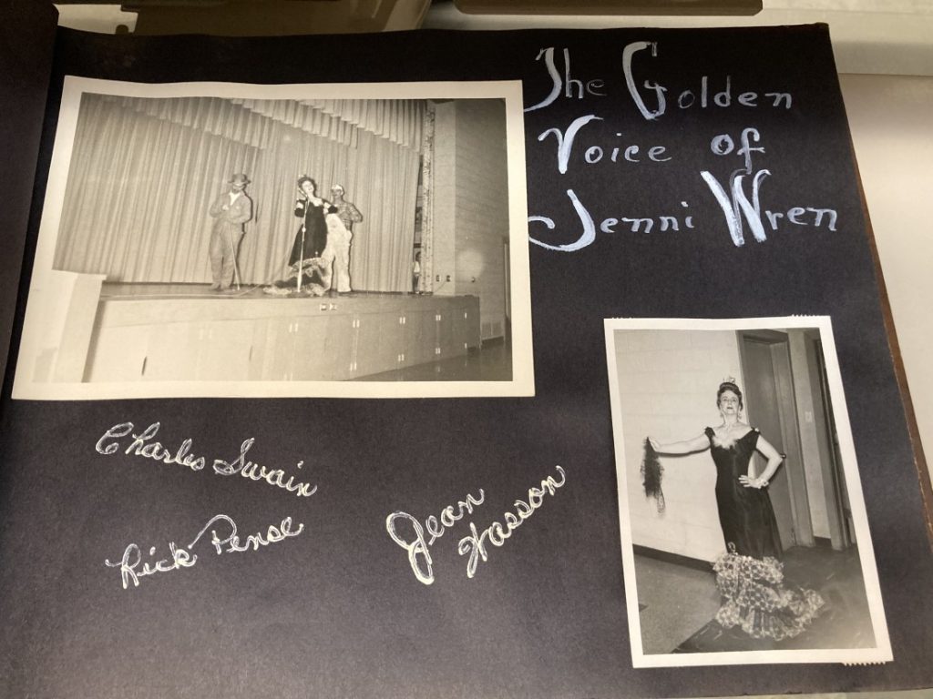 Black album page with two black-and-white photographs and "The Golden Voice of Jenni Wren" written in white.
