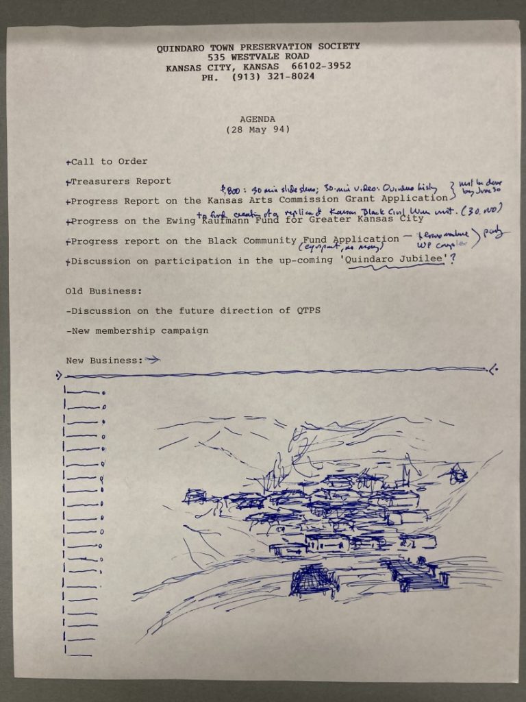 Document with black typed text plus handwritten notes and a sketch in blue ink.