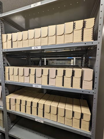Boxes of glass plate negatives in the stacks of Kenneth Spencer Research Library, University of Kansas Libraries.