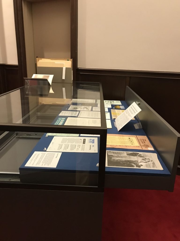 Exhibit case with installed items.