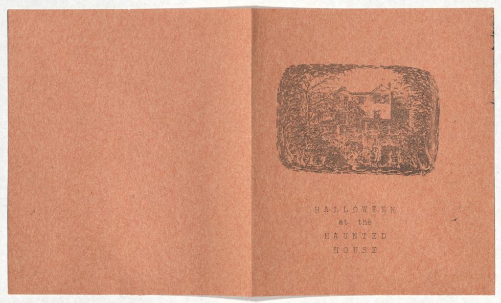 Folded orange paper with a black-and-white illustration of a house and the text "Halloween at the Haunted House."