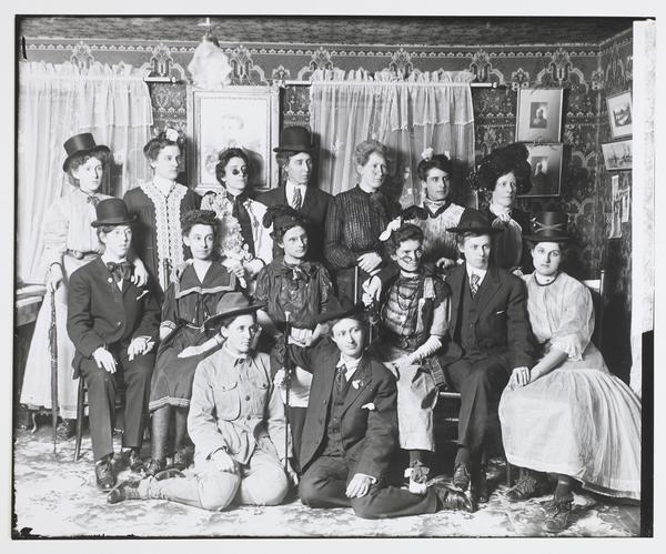 Black-and-white photograph of women wearing costumes and disguises.