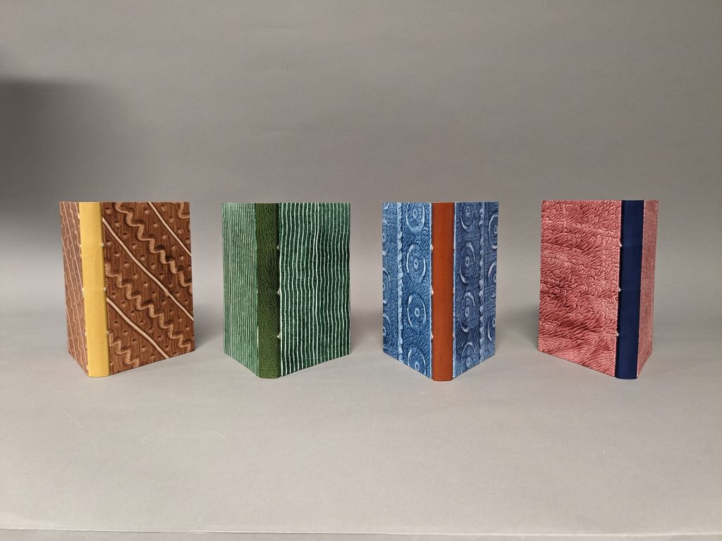 Four finished Even More Simplified bindings created in our workshop with Karen Hanmer.