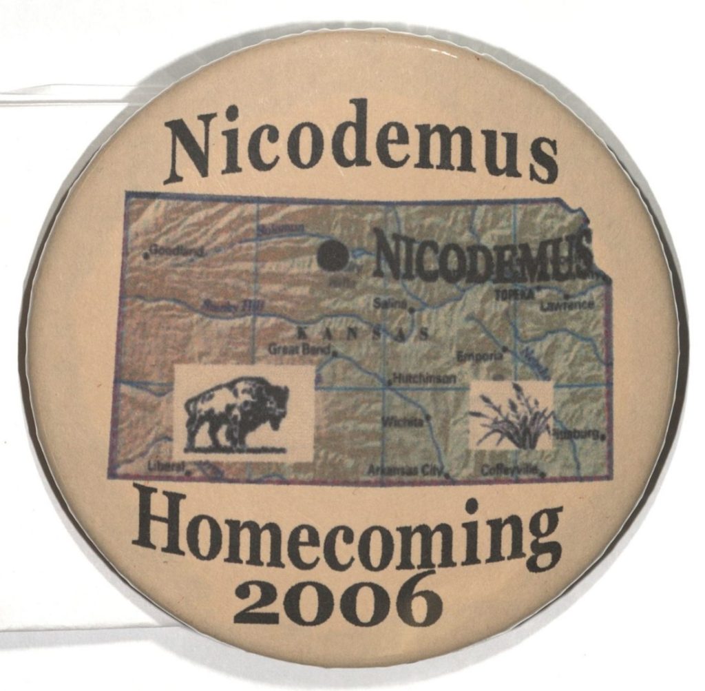 Round button with a tan background, the text "Nicodemus Homecoming 2006," and a map of Kansas.