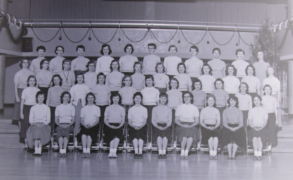 Group of women posed for a formal portrait.