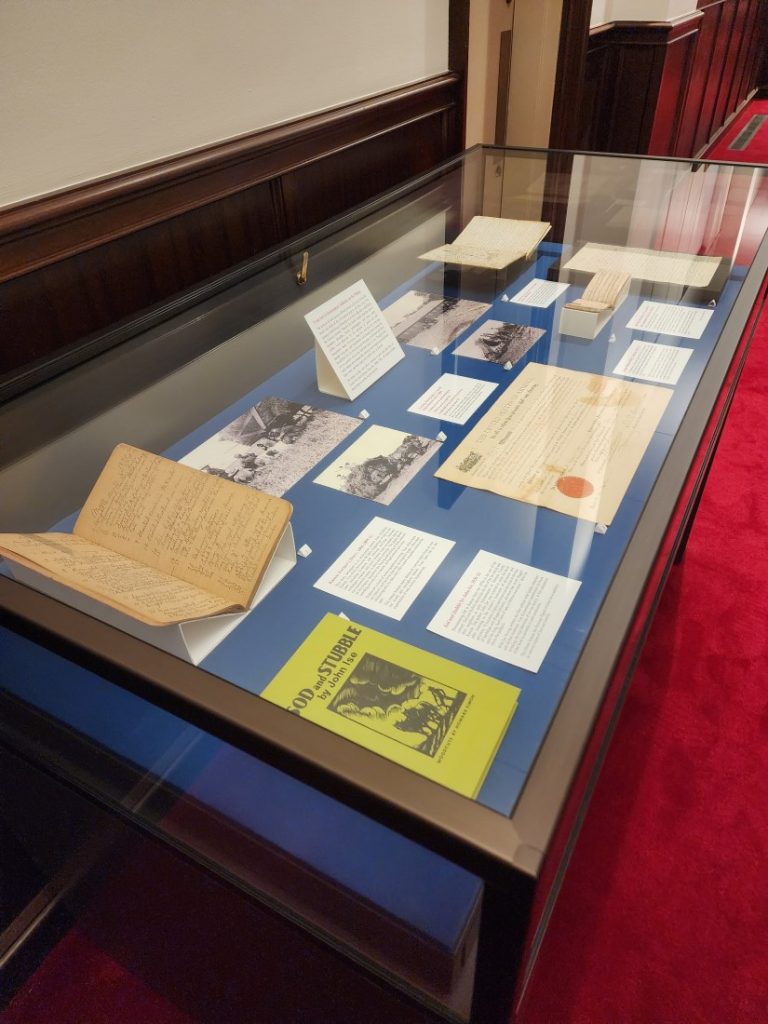 An exhibit case with items and labels.