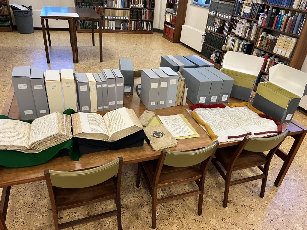 The Graziani-Commendone Collection, as housed in manuscript boxes and protective enclosures, pictured in the Spencer Research Library's Reading Room.