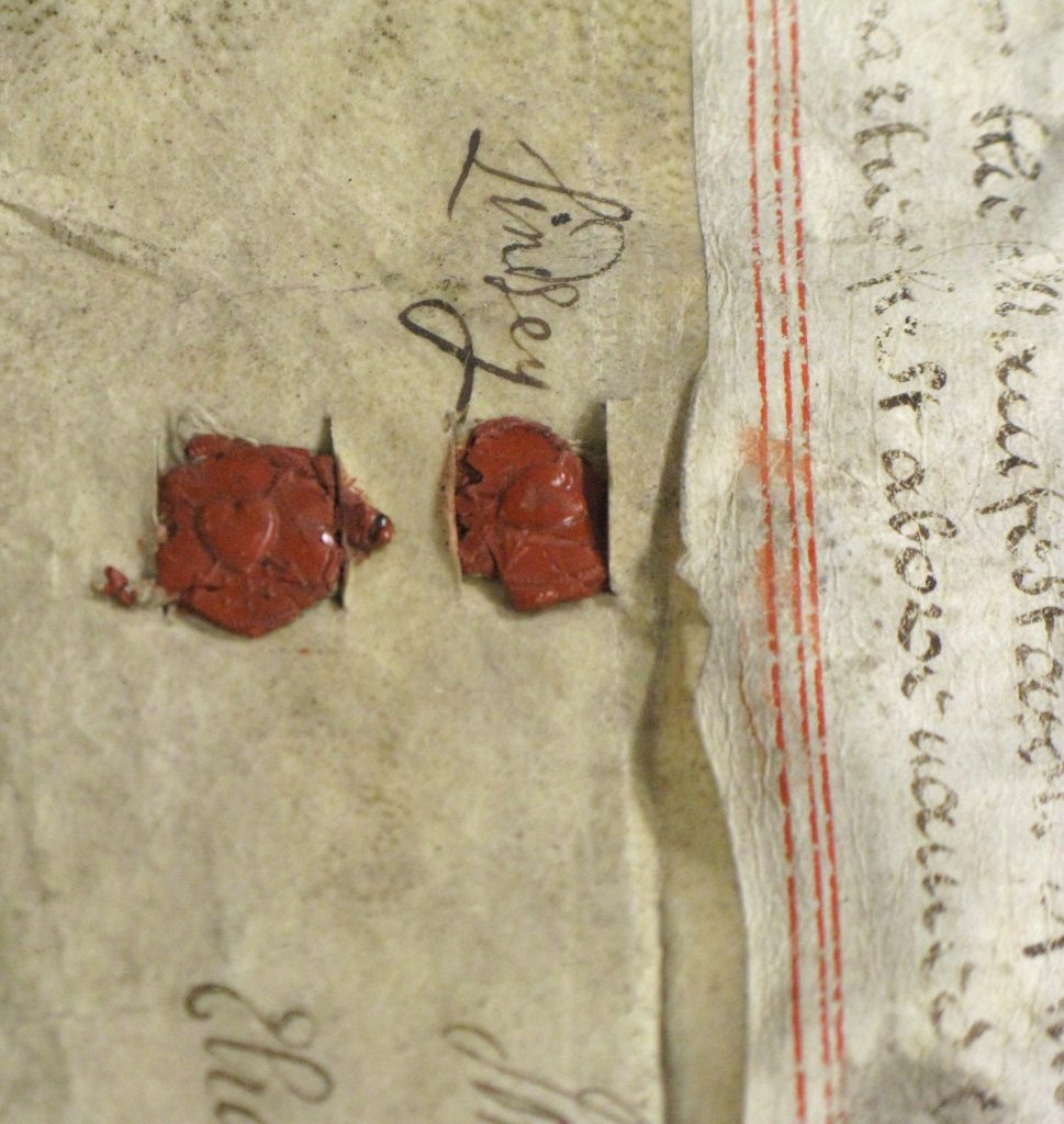 Detail two wax seals imprinted with hearts, on a parchment document