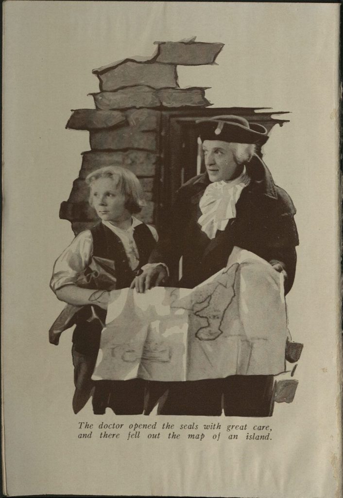 Black-and-white photograph of a man and boy looking at a large map.