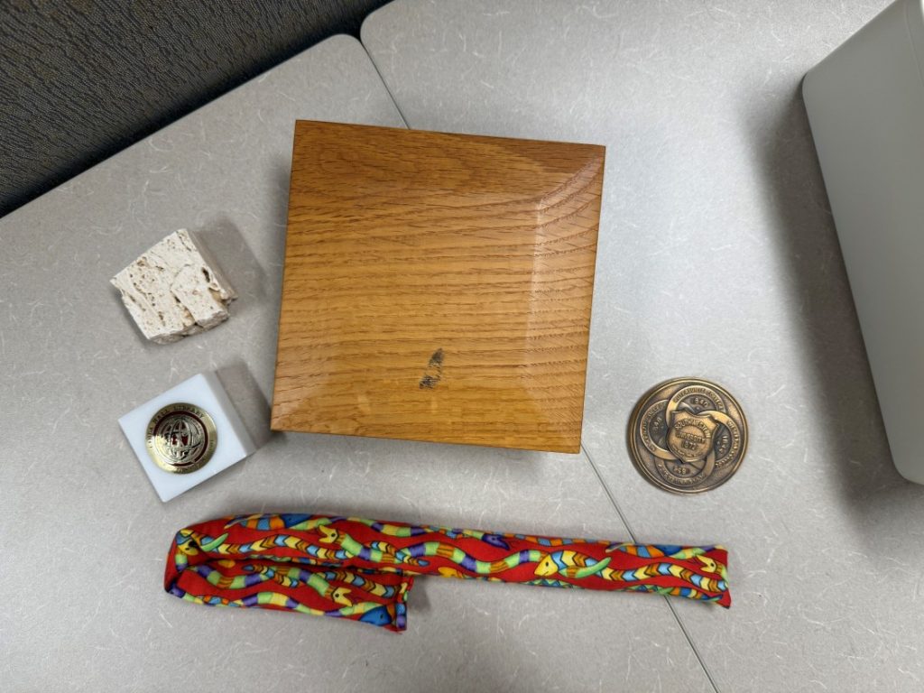 Photograph of a wooden box and mementos. 
