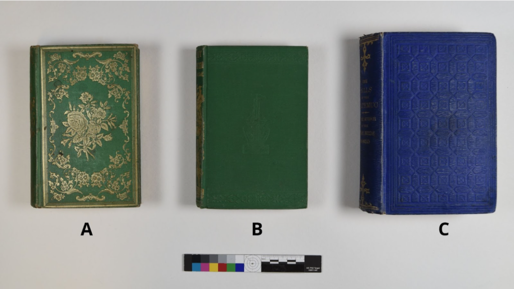 Three volumes from various Spencer collections. Books A (green) and C (blue) tested positive for arsenic; book B (green) did not.