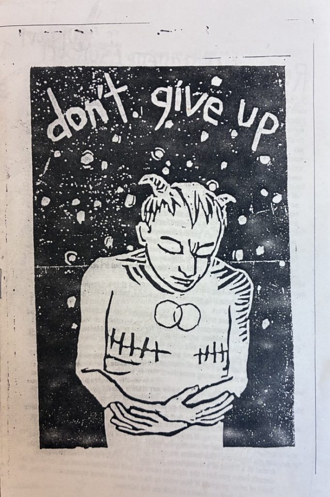 Front cover of the zine, which has a white background with a black inset that has the title in white text and a black-and-white sketch of person folding their arms.