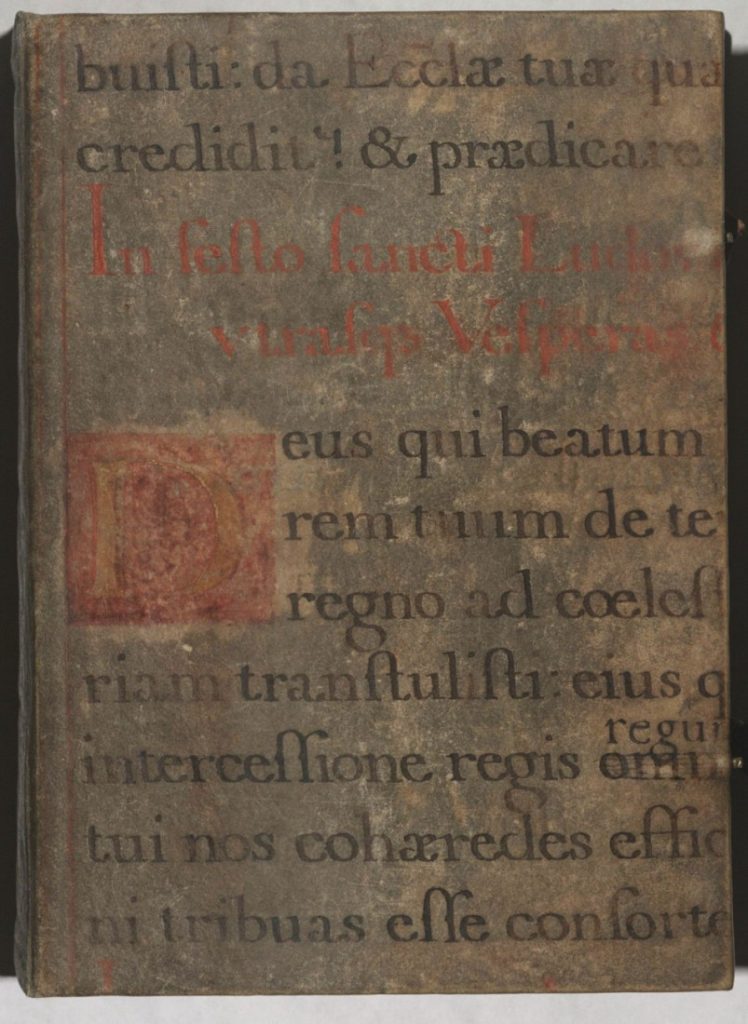 Section of a medieval manuscript with black and red text in Latin.